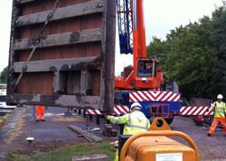 Refurbished lock mitre gates being lifted back at Fiddlers Ferry, Penketh, Warrington, Cheshire WA5 2UJ in 2011
