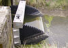 Stainless Steel and HDPE Tilting Weir flat wall mounted to a concrete head wall