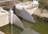 Wall mounted beamless Tilting Weir